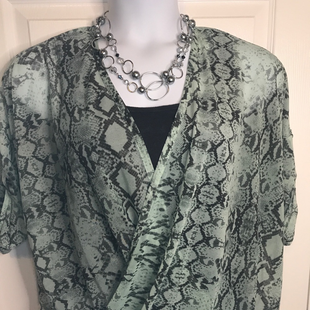 Jennifer Lopez snake skin print sheer blouse